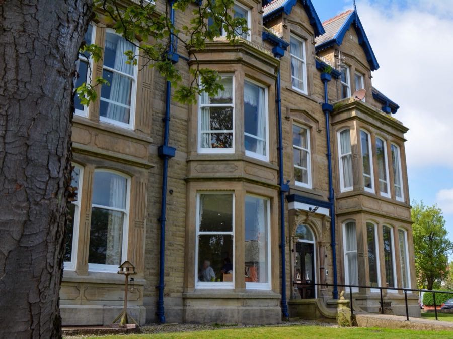 Exterior of Rose House care home, a stone Georgian manor house in St Annes